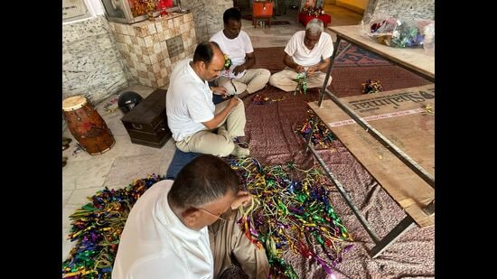Staff members meticulously adding the final touches to the jhanki decorations ahead of Janmashtami at one of the temples in PAC HQ Mahanagar. (HT Photo)