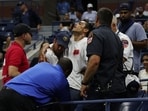 A fan receives medical attention in the stands during the quarter final match between Czech Republic's Marketa Vondrousova and Madison Keys of the U.S.