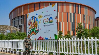 A security personnel with a sniffer dog outside Pragati Maidan ahead of the G20 Summit, in New Delhi, Thursday. (PTI) A security personnel with a sniffer dog outside Pragati Maidan ahead of the G20 Summit, in New Delhi, Thursday. (PTI)