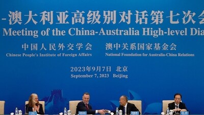 Australia's former trade minister Craig Emerson and China's former foreign minister Li Zhaoxing shake hands at the 7th China-Australia High Level Dialogue at the Diaoyutai State Guesthouse in Beijing on September 7, 2023. (AFP/File)