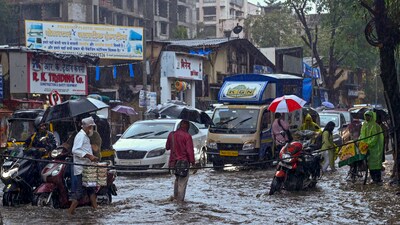 Vehicles move on a waterlogged road following heavy rain at Andheri, in Mumbai, Thursday, Sept. 7. (PTI) Vehicles move on a waterlogged road following heavy rain at Andheri, in Mumbai, Thursday, Sept. 7. (PTI)