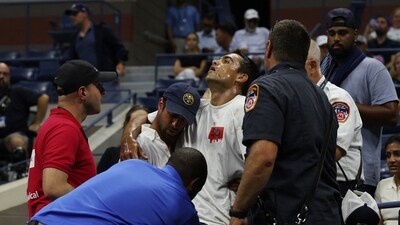 A fan receives medical attention in the stands during the quarter final match between Czech Republic's Marketa Vondrousova and Madison Keys of the U.S. (REUTERS)
