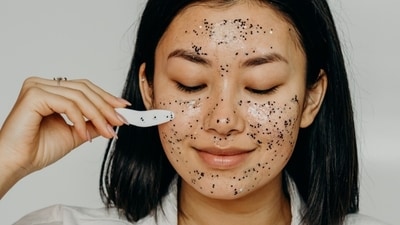 2. Exfoliate The Rain Away - Time to say goodbye to dead skin cells! Exfoliation is vital during the monsoon season to unclog your pores and prevent dullness. Opt for a mild exfoliator to avoid over-scrubbing and have healthy looking skin. “Exfoliators work as gentle scrubbing agents and are often made with abrasive ingredients that can be harsh on the skin. Instead opt for kind options that steer clear of colour, alcohol and fragrance to let your skin feel calm and relaxed.” said Dr Soumi. (Pexels) 2. Exfoliate The Rain Away - Time to say goodbye to dead skin cells! Exfoliation is vital during the monsoon season to unclog your pores and prevent dullness. Opt for a mild exfoliator to avoid over-scrubbing and have healthy looking skin. “Exfoliators work as gentle scrubbing agents and are often made with abrasive ingredients that can be harsh on the skin. Instead opt for kind options that steer clear of colour, alcohol and fragrance to let your skin feel calm and relaxed.” said Dr Soumi. (Pexels)