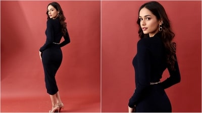 Her stunning navy blue bodycon dress is by Michael Michael Kors and costs <span class='webrupee'>₹</span>31k. It features a logo-embossed appliqué at the back, two snap pockets and ribbing at the v-neckline, bottom hem and long sleeves paired with a gold chain belt. (Instagram/@manushi_chhillar) Her stunning navy blue bodycon dress is by Michael Michael Kors and costs <span class='webrupee'>₹</span>31k. It features a logo-embossed appliqué at the back, two snap pockets and ribbing at the v-neckline, bottom hem and long sleeves paired with a gold chain belt. (Instagram/@manushi_chhillar)