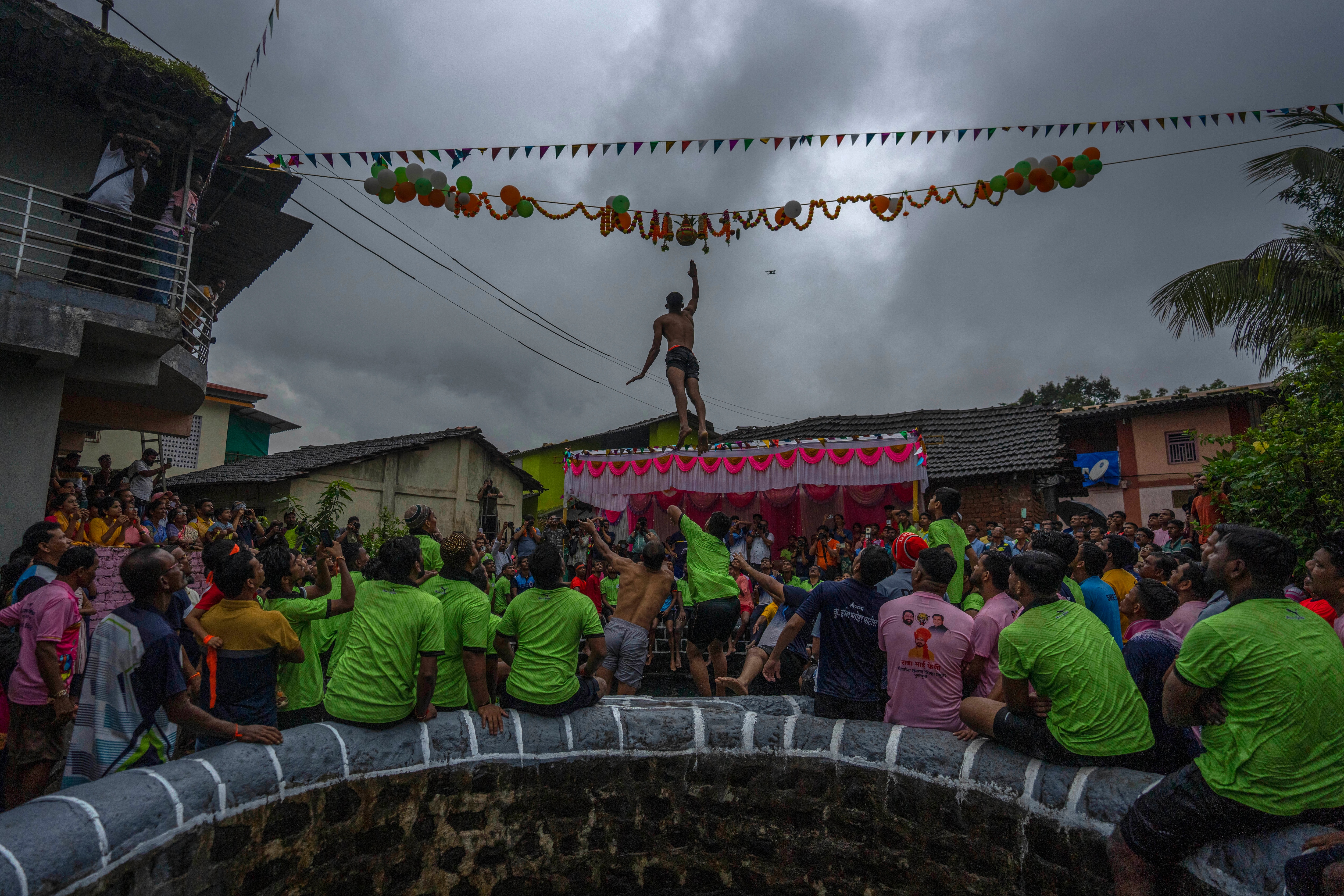 A boy jumps as he attempts to break the Dahi handi pot in Kurdus village, Maharashtra, (AP Photo/Rafiq Maqbool) A boy jumps as he attempts to break the Dahi handi pot in Kurdus village, Maharashtra, (AP Photo/Rafiq Maqbool)