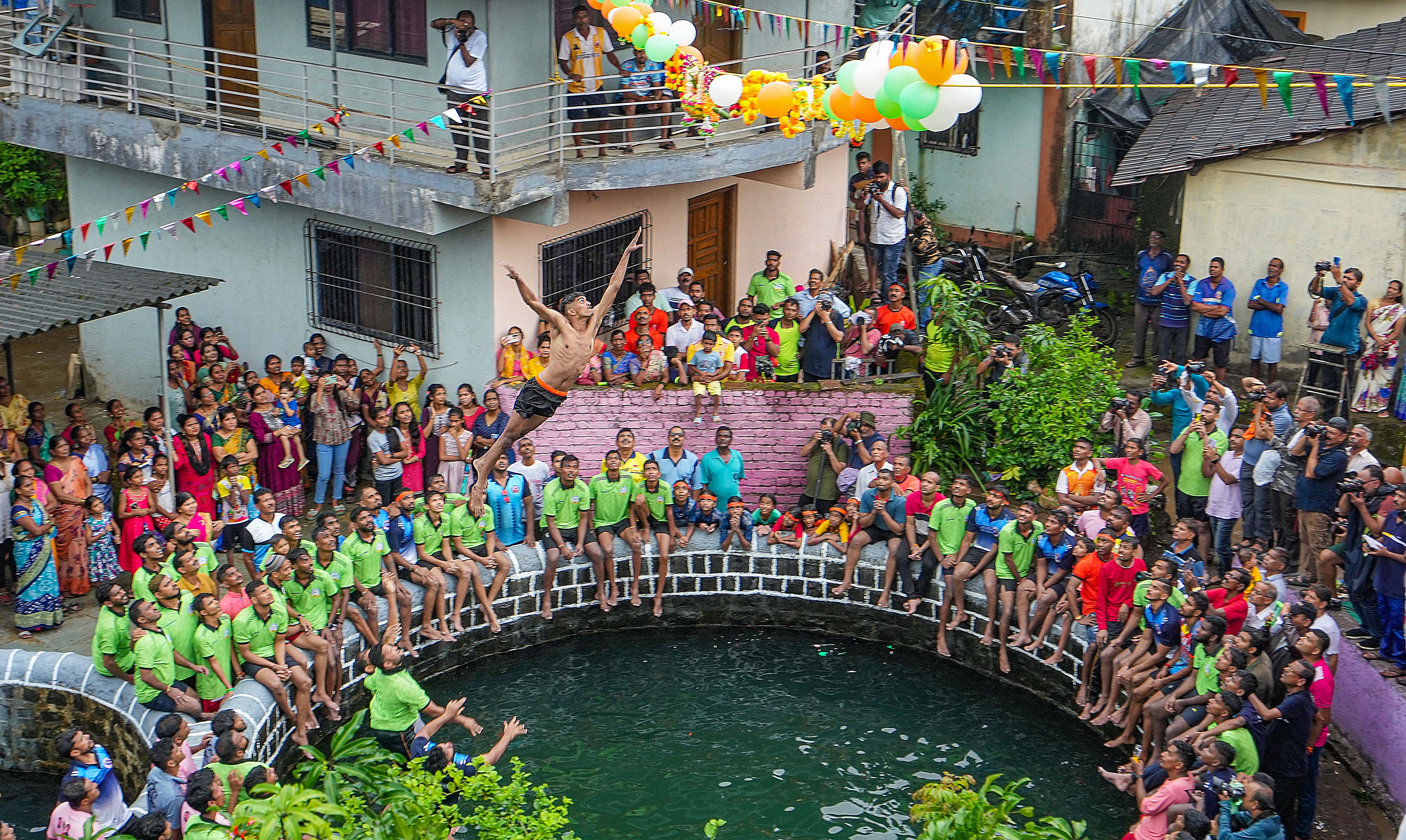 A Govinda dives to break the "Dahi Handi" in Alibaug. (PTI Photo/Shashank Parade) A Govinda dives to break the "Dahi Handi" in Alibaug. (PTI Photo/Shashank Parade)