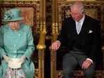 Britain's Queen Elizabeth II and Charles seen after delivering the Queen's Speech at the State Opening of Parliament in the Houses of Parliament in London.