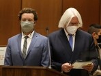 FILE PHOTO: Actor Danny Masterson stands with his lawyer Thomas Mesereau as he is arraigned on three rape charges in separate incidents between 2001 and 2003, at Los Angeles Superior Court, Los Angeles, California, U.S., September 18, 2020. REUTERS/Lucy Nicholson/File Photo
