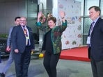 Managing Director of the International Monetary Fund Kristalina Georgieva shakes a leg as she receives a traditional welcome upon her arrival at the airport ahead of the G20 Summit, in New Delhi.