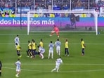 Lionel Messi scores from a free-kick against Ecuador