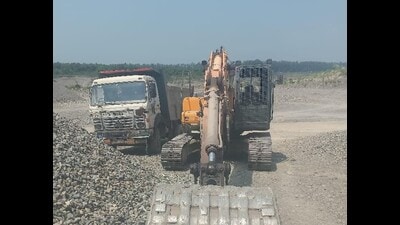 A truck and an excavator seized during a raid on illegal mining activity in Pathankot on Friday. (HT Photo)