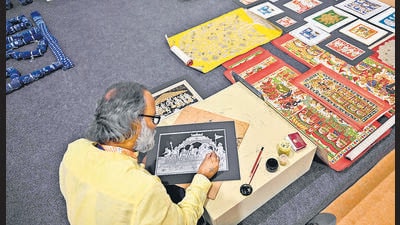 An artist at work at the Crafts Bazaar. (AFP)