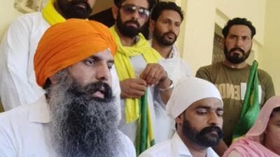 Balwinder Singh shares his experience with fellow villagers after he returns home at Muktsar's Mallan village on Friday afternoon. (Sanjeev Kumar/HT)