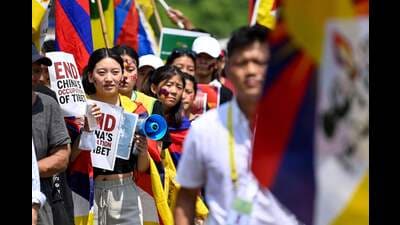 Members of the Tibetan Youth Congress (TYC) hold placards as they carry the Tibetan flags during a protest against China's alleged occupation over Tibet and their partcipation in the upcoming G20 India summit in New Delhi on September 8. (AFP)