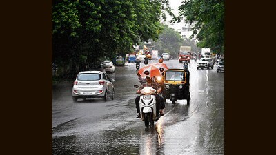 Motorist seen during rain on NDA road in Bavdhan in Pune on Friday. (KALPESH NUKTE/ HT PHOTO) Motorist seen during rain on NDA road in Bavdhan in Pune on Friday. (KALPESH NUKTE/ HT PHOTO)