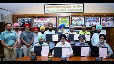 PAU officials during signing of the MoAs with four Punjab-based firms in Ludhiana on Friday. (HT)
