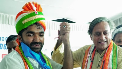 Congress MP Shashi Tharoor with party candidate and former Kerala CM Oommen Chandy's son Chandy Oommen during his election campaign ahead of Puthuppally assembly constituency by-polls, in Kottayam. (PTI) Congress MP Shashi Tharoor with party candidate and former Kerala CM Oommen Chandy's son Chandy Oommen during his election campaign ahead of Puthuppally assembly constituency by-polls, in Kottayam. (PTI)