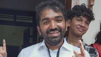 Chandy Oommen with family members after casting vote during bypolls at Puthuppally in Kottayam district on September 5. (PTI) Chandy Oommen with family members after casting vote during bypolls at Puthuppally in Kottayam district on September 5. (PTI)