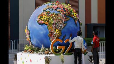 Workers at the International Media Center in New Delhi on Friday. (AFP)