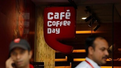 Men stand outside a Cafe Coffee Day outlet in New Delhi, India. (Reuters file) Men stand outside a Cafe Coffee Day outlet in New Delhi, India. (Reuters file)