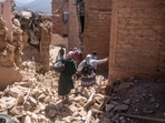 Residents flee their homes after an earthquake in Moulay Brahim village, near the epicenter of the earthquake, outside Marrakech, Morocco, Saturday, Sept. 9.