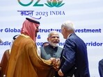 Saudi Arabian Crown Prince Mohammed bin Salman Al Saud, left, and U.S. President Joe Biden, right, shake hands next to Indian Prime Minister Narendra Modi