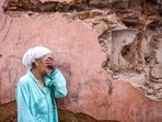 A woman reacts standing infront of her earthquake-damaged house in the old city in Marrakesh on September 9.