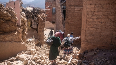 Residents flee their homes after an earthquake in Moulay Brahim village, near the epicenter of the earthquake, outside Marrakech, Morocco, Saturday, Sept. 9. (AP) Residents flee their homes after an earthquake in Moulay Brahim village, near the epicenter of the earthquake, outside Marrakech, Morocco, Saturday, Sept. 9. (AP)