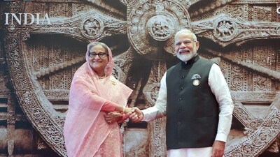 Indian Prime Minister Narendra Modi, right, shakes hand with Bangladesh's Prime Minister Sheikh Hasina upon her arrival at Bharat Mandapam convention centre for the G20 Summit in New Delhi, India, on Saturday, September 9. (HT Photo) Indian Prime Minister Narendra Modi, right, shakes hand with Bangladesh's Prime Minister Sheikh Hasina upon her arrival at Bharat Mandapam convention centre for the G20 Summit in New Delhi, India, on Saturday, September 9. (HT Photo)