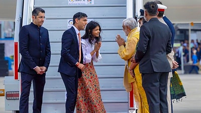 Prime Minister of the United Kingdom Rishi Sunak and First Lady of the United Kingdom Akshata Murty being welcomed by Union Minister Ashwini Kumar Choubey upon their arrival at Palam Airforce Airport on Friday. (PTI) Prime Minister of the United Kingdom Rishi Sunak and First Lady of the United Kingdom Akshata Murty being welcomed by Union Minister Ashwini Kumar Choubey upon their arrival at Palam Airforce Airport on Friday. (PTI)