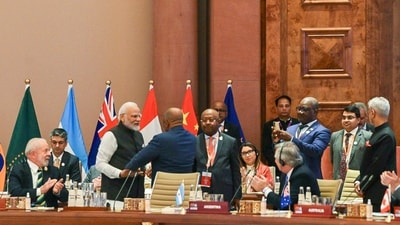 PM Modi hugs President of the Union of the Comoros and Chairperson of the African Union (AU) Azali Assoumani as the latter takes his seat after the Union became a permanent member of the G20 during the G20 Summit 2023 at the Bharat Mandapam in New Delhi on Saturday. (PTI) PM Modi hugs President of the Union of the Comoros and Chairperson of the African Union (AU) Azali Assoumani as the latter takes his seat after the Union became a permanent member of the G20 during the G20 Summit 2023 at the Bharat Mandapam in New Delhi on Saturday. (PTI)