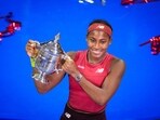 Coco Gauff poses for photographs after defeating Aryna Sabalenka, of Belarus, at the women's singles final of the U.S. Open tennis championships