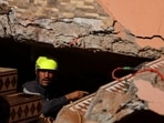 A rescue worker takes part in a search and rescue operation, in the aftermath of a deadly earthquake in Ouirgane, Morocco.