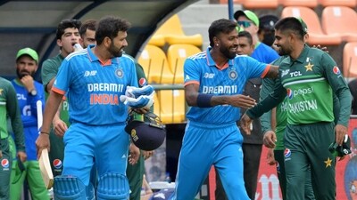 India skipper Rohit Sharma with teammate Hardik Pandya and Pakistan skipper Babar Azam on the sidelines during their match in the Asia Cup 2023 (ICC Twitter) India skipper Rohit Sharma with teammate Hardik Pandya and Pakistan skipper Babar Azam on the sidelines during their match in the Asia Cup 2023 (ICC Twitter)