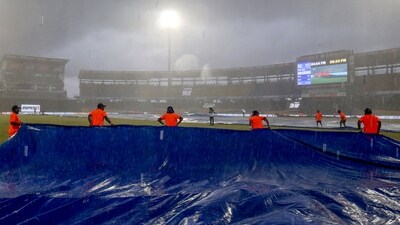 Ground staff come up with covers as rain stops play during the Super Fours match between India and Pakistan in the Asia Cup 2023, at R.Premadasa Stadium (ANI ) Ground staff come up with covers as rain stops play during the Super Fours match between India and Pakistan in the Asia Cup 2023, at R.Premadasa Stadium (ANI )