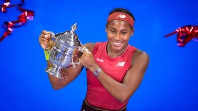 Coco Gauff poses for photographs after defeating Aryna Sabalenka, of Belarus, at the women's singles final of the U.S. Open tennis championships (AP)
