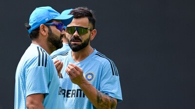 India's captain Rohit Sharma (L) talks with teammate Virat Kohli during a practice session (AFP) India's captain Rohit Sharma (L) talks with teammate Virat Kohli during a practice session (AFP)