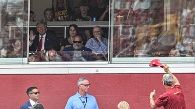 Sep 9, 2023; Ames, Iowa, USA; Former President of the United States Donald Trump waves to a supporter while attending the game between the Iowa State Cyclones and the Iowa Hawkeyes at Jack Trice Stadium. Mandatory Credit: Jeffrey Becker-USA TODAY Sports (USA TODAY Sports via Reuters Con)