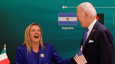 Italian Prime Minister Giorgia Meloni and U.S. President Joe Biden react at the launch of the Global Biofuels Alliance at the G20 summit in New Delhi, India. (REUTERS)