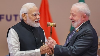 Prime Minister Narendra Modi hands over the G20 Presidency to the President of Brazil Luiz Inacio Lula da Silva after the closing session of the G20 Summit 2023 at the Bharat Mandapam, in New Delhi, on Sunday. (PTI) Prime Minister Narendra Modi hands over the G20 Presidency to the President of Brazil Luiz Inacio Lula da Silva after the closing session of the G20 Summit 2023 at the Bharat Mandapam, in New Delhi, on Sunday. (PTI)