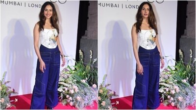 Rakul wore it with high-waisted dark blue-coloured denim pants featuring contrast lining, straight-leg fitting, and a relaxed silhouette. She accessorised the ensemble with peep-toe black high heels, a sleek watch, rings, and statement earrings.&nbsp; (Instagram)
