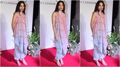 Sobhita Dhulipala's sleeveless maxi dress is a statement and versatile look for date nights or grabbing drinks with your girlfriends. It comes decorated in an ombre pattern of blue, pink and light brown shades, and features a ribbed design, halter neckline, a relaxed fitting, faux wrap detail on the front, and a ruched hem.&nbsp; (Instagram)