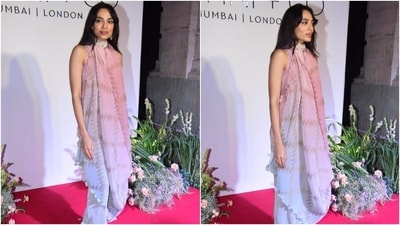 Sobhita accessorised the outfit with embellished high heels, a stylish choker necklace, and dangling earrings. Lastly, she chose sleek eyeliner, mascara on the lashes, brick-coloured glossy lip shade, rouge-tinted cheeks, feathered brows, subtle eye shadow, dewy base, and centre-parted open wavy locks.&nbsp; (Instagram)