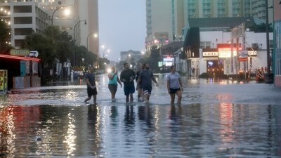 People walk up a flooded Ocean Boulevard in North Myrtle Beach, S.C. on Wednesday. (AP file) People walk up a flooded Ocean Boulevard in North Myrtle Beach, S.C. on Wednesday. (AP file)