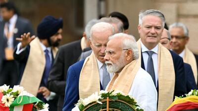 US President Joe Biden at the Raj Ghat memorial with Prime Minister of India Narendra Modi and other G20 leaders. (REUTERS) US President Joe Biden at the Raj Ghat memorial with Prime Minister of India Narendra Modi and other G20 leaders. (REUTERS)