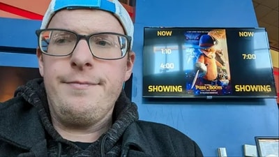 Zach Swope smiling for the camera before watching Puss in Boots: The Last Wish. He watched this film a staggering 47 times. (Guinness World Records) Zach Swope smiling for the camera before watching Puss in Boots: The Last Wish. He watched this film a staggering 47 times. (Guinness World Records)