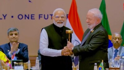 Prime Minister Narendra Modi seen handing over the presidency of G20 to Brazil's President Luiz Inacio da Silva after the closing session of the G20 Summit 2023 at the Bharat Mandapam in New Delhi. “I want to congratulate Brazil's president and my friend Lula da Silva, and hand over the presidency's gavel to him,” Modi said. (PTI) Prime Minister Narendra Modi seen handing over the presidency of G20 to Brazil's President Luiz Inacio da Silva after the closing session of the G20 Summit 2023 at the Bharat Mandapam in New Delhi. “I want to congratulate Brazil's president and my friend Lula da Silva, and hand over the presidency's gavel to him,” Modi said. (PTI)