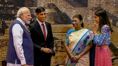 Prime Minister Modi and President Droupadi Murmu seen along with UK PM Rishi Sunak and First Lady Akshata Murty upon their arrival at the Bharat Mandapam for the Gala Dinner during the G20 Summit on Saturday. The First Lady was seen wearing Indian attire when she reached to attend the event. (PTI) Prime Minister Modi and President Droupadi Murmu seen along with UK PM Rishi Sunak and First Lady Akshata Murty upon their arrival at the Bharat Mandapam for the Gala Dinner during the G20 Summit on Saturday. The First Lady was seen wearing Indian attire when she reached to attend the event. (PTI)
