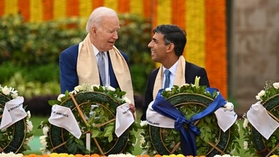 US President Joe Biden, UK PM Rishi Sunak seen engaged in a conversation as they pay tribute to the great leader at Rajghat. (PTI) US President Joe Biden, UK PM Rishi Sunak seen engaged in a conversation as they pay tribute to the great leader at Rajghat. (PTI)