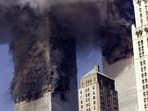 (FILES) (FILES) In this file photo smoke billows from the twin towers of the World Trade Center in lower Manhattan, New York on September 11, 2001. A proposal to allow alleged perpetrators of the 9/11 attacks to plead guilty and avoid the death penalty poses a powerful dilemma for victims' families, some of whom still want to seek the ultimate retribution after two decades of legal limbo. The proposal detailed by prosecutors in a letter this month could offer families of the nearly 3,000 victims the best path to a resolution of a case bogged down in pre-trial maneuverings in the Guantanamo military commissions for years -- and with no end in sight. (Photo by STAN HONDA / AFP) (FILES) (FILES) In this file photo smoke billows from the twin towers of the World Trade Center in lower Manhattan, New York on September 11, 2001. A proposal to allow alleged perpetrators of the 9/11 attacks to plead guilty and avoid the death penalty poses a powerful dilemma for victims' families, some of whom still want to seek the ultimate retribution after two decades of legal limbo. The proposal detailed by prosecutors in a letter this month could offer families of the nearly 3,000 victims the best path to a resolution of a case bogged down in pre-trial maneuverings in the Guantanamo military commissions for years -- and with no end in sight. (Photo by STAN HONDA / AFP)